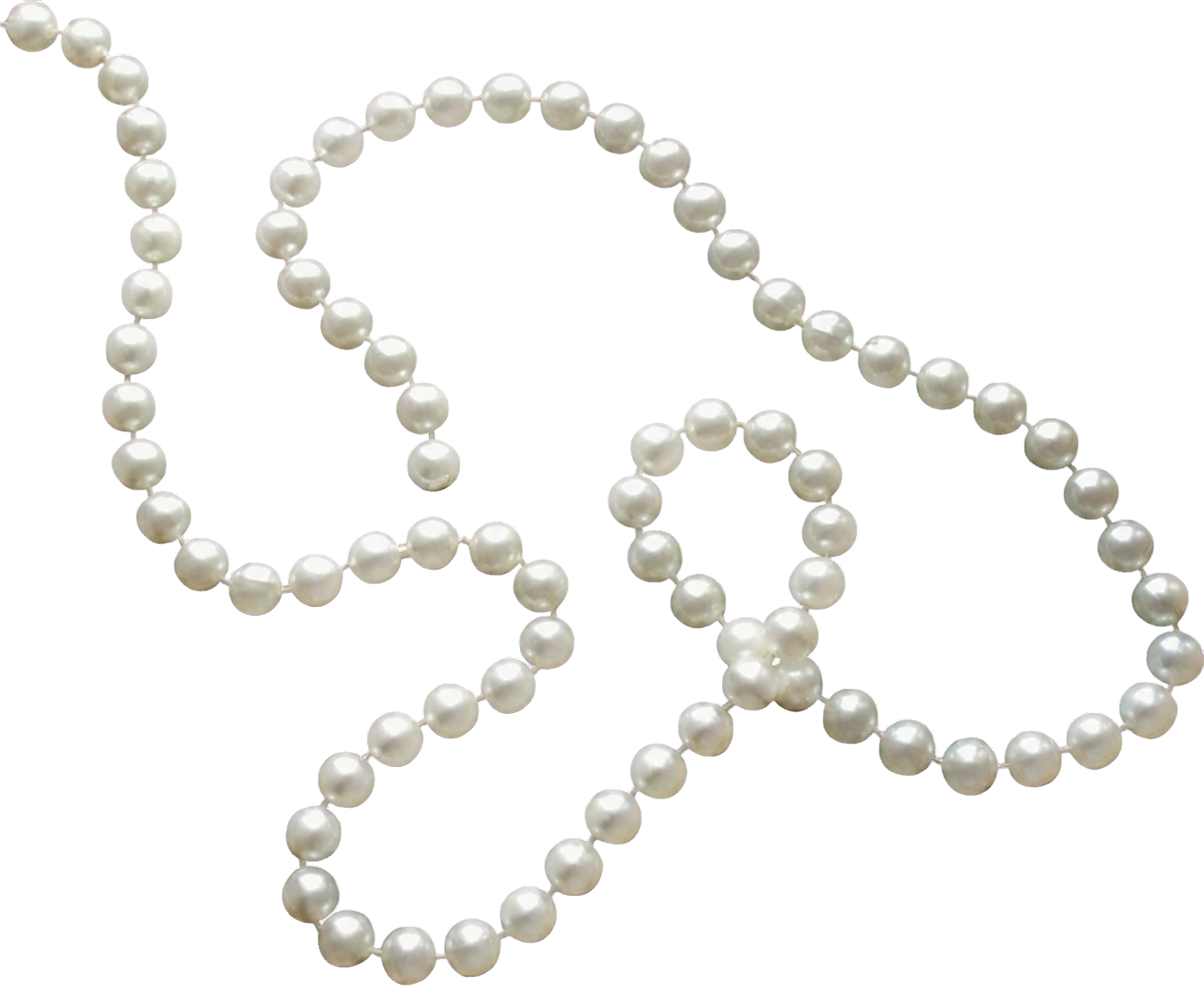 Real ivory pearl strand arranged across the scrapbook